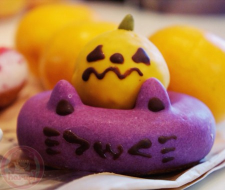 Happy Halloween purple cat doughnut with pumpkin top