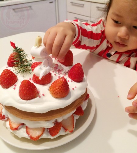 Garnishing the Christmas Strawberry Pancake cake!