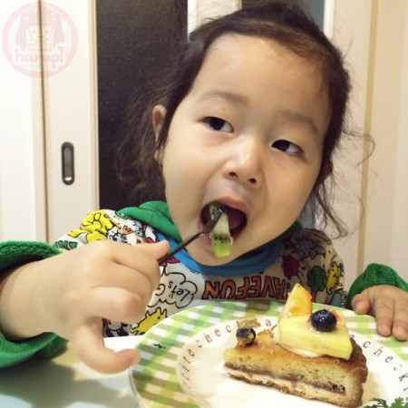 Little-big-boss eating cake before daddy