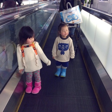 Little-big-boss and Yuki-chan on a flat escalator