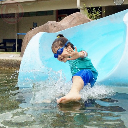 Sliding on the water slide so professionally..