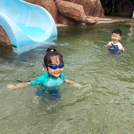 Little-big-boss and cousin in the kiddie pool